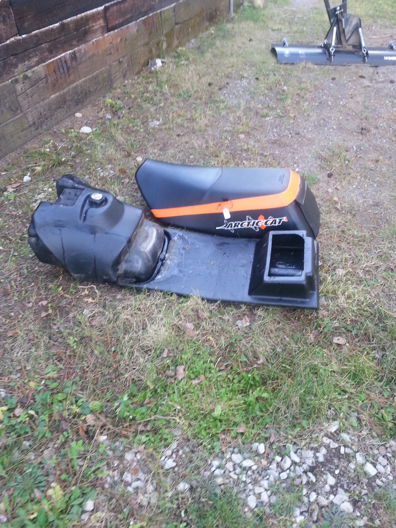 On new sleds the fuel tank and seat are separate. My old seat was stapled directly to the tank base.